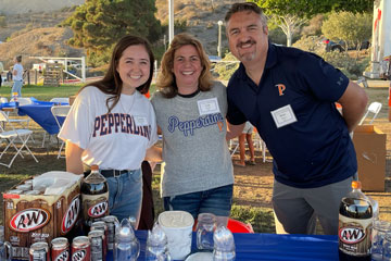 Seaver alumni participating in the student mugging tradition